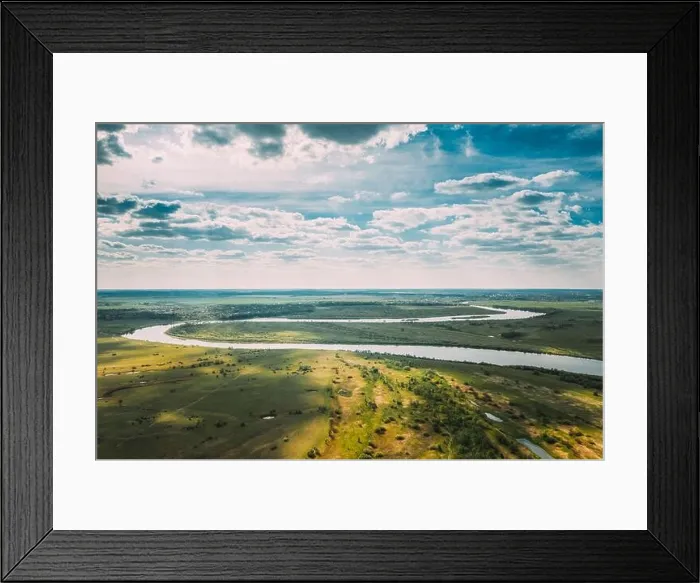 Framed Print : Rechytsa, Gomel Region, Belarus. Aerial View Of Dnieper River. Sunny Sky Above Green Meadow And River Landscape. Top View Of European Nature From High Framed Print : Rechytsa, Gomel Region, Belarus. Aerial View Of Dnieper River. Sunny Sky Above Green Meadow And River Landscape. Top View Of European Nature From High
