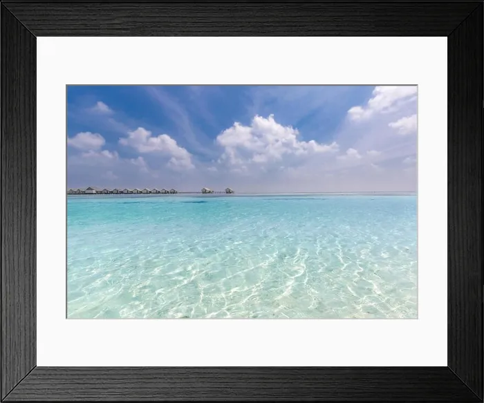Framed Print : Amazing beach scene in Maldives island. Tropical sea and luxury over water bungalows Framed Print : Amazing beach scene in Maldives island. Tropical sea and luxury over water bungalows