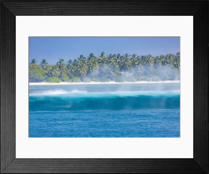 Framed Print : Tropical island and sea with waves splash and palm trees in background Framed Print : Tropical island and sea with waves splash and palm trees in background