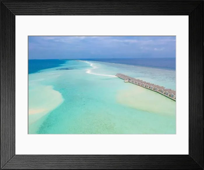 Framed Print : Perfect aerial landscape, luxury tropical resort or hotel with water villas and beautiful beach scenery. Amazing bird eyes view in Maldives, landscape