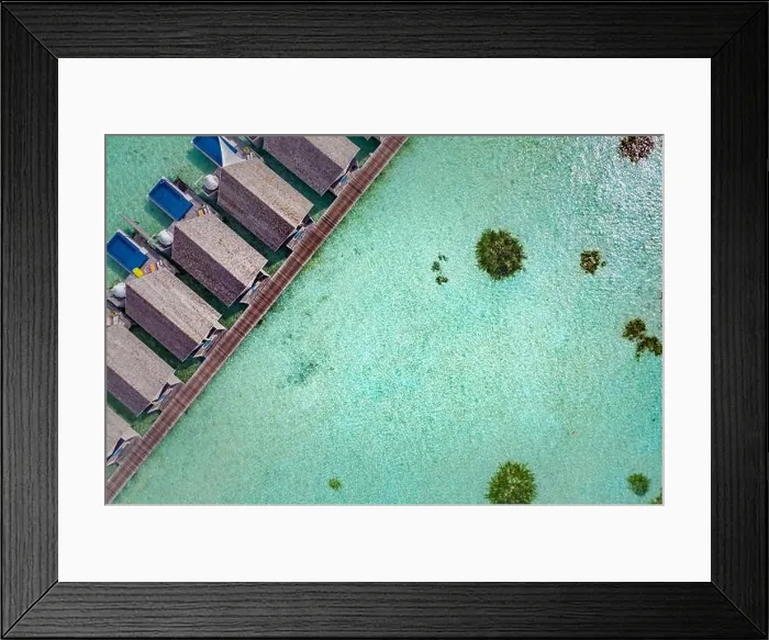 Framed Print : Perfect aerial landscape, luxury tropical resort or hotel with water villas and beautiful beach scenery. Amazing bird eyes view in Maldives, landscape
