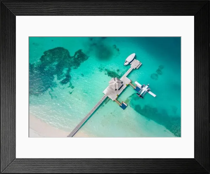 Framed Print : Perfect aerial landscape, luxury tropical resort or hotel with water villas and beautiful beach scenery. Amazing bird eyes view in Maldives, landscape Framed Print : Perfect aerial landscape, luxury tropical resort or hotel with water villas and beautiful beach scenery. Amazing bird eyes view in Maldives, landscape