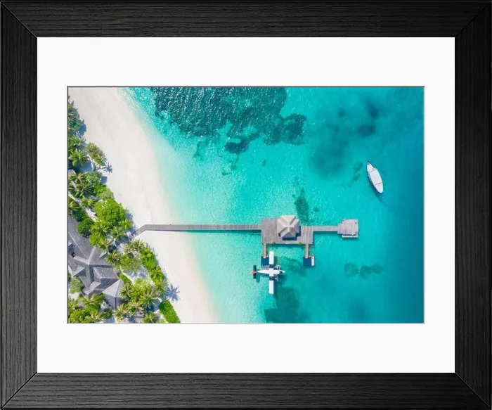 Framed Print : Perfect aerial landscape, luxury tropical resort or hotel with water villas and beautiful beach scenery. Amazing bird eyes view in Maldives, landscape Framed Print : Perfect aerial landscape, luxury tropical resort or hotel with water villas and beautiful beach scenery. Amazing bird eyes view in Maldives, landscape