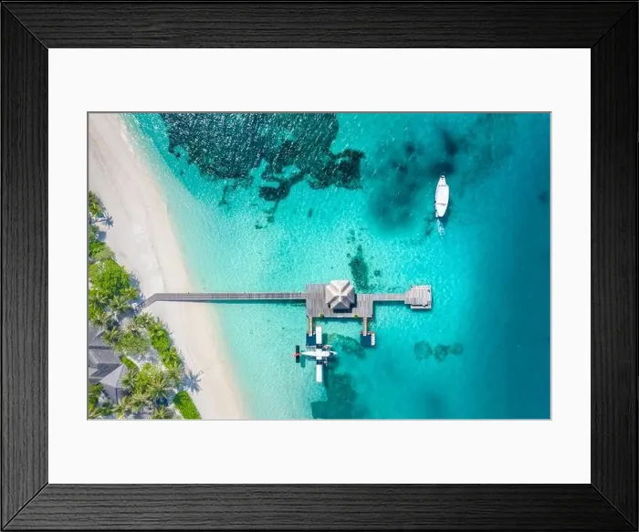 Framed Print : Perfect aerial landscape, luxury tropical resort or hotel with water villas and beautiful beach scenery. Amazing bird eyes view in Maldives, landscape Framed Print : Perfect aerial landscape, luxury tropical resort or hotel with water villas and beautiful beach scenery. Amazing bird eyes view in Maldives, landscape
