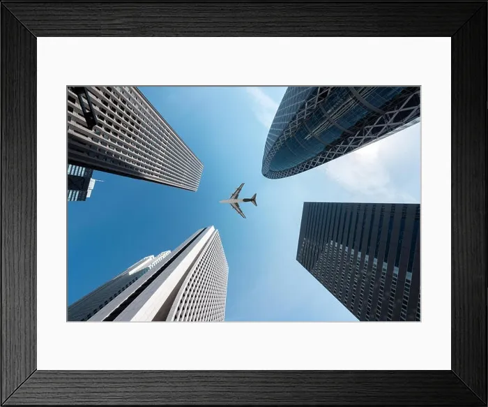 Framed Print : Tokyo skyscrapers buildings and a plane flying overhead at in Tokyo Shinjuku downtown and business district in morning at Tokyo, Japan Framed Print : Tokyo skyscrapers buildings and a plane flying overhead at in Tokyo Shinjuku downtown and business district in morning at Tokyo, Japan