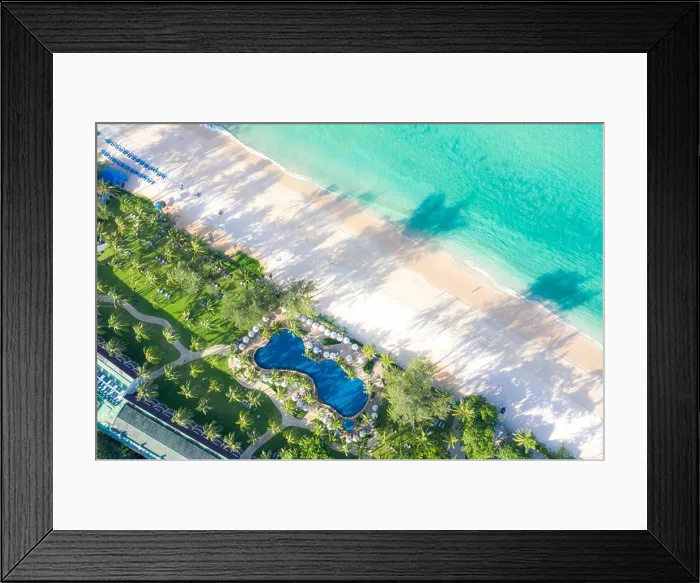 Framed Print : Aerial view of swimming pool with sea and beach in luxury hotel and resort for travel and vacation