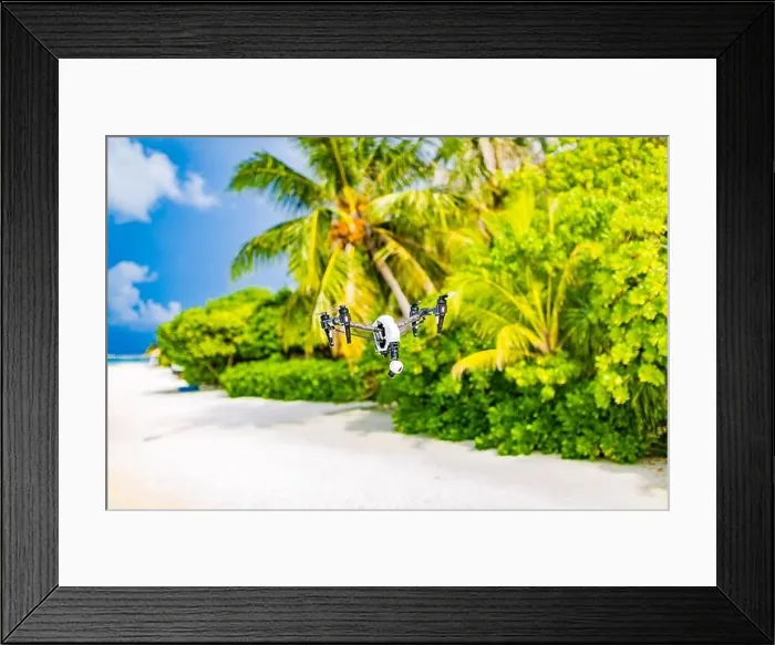 Framed Print : Drone flying over sea coast and palm trees. Tropical footage or photo creating. UAV professional drone in exotic island view Framed Print : Drone flying over sea coast and palm trees. Tropical footage or photo creating. UAV professional drone in exotic island view