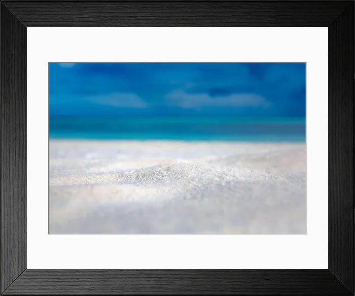 Framed Print : Sandy beach and beautiful tropical sea on blue sky background. Summer sand beach background. Sea and sky. Summer concept Framed Print : Sandy beach and beautiful tropical sea on blue sky background. Summer sand beach background. Sea and sky. Summer concept