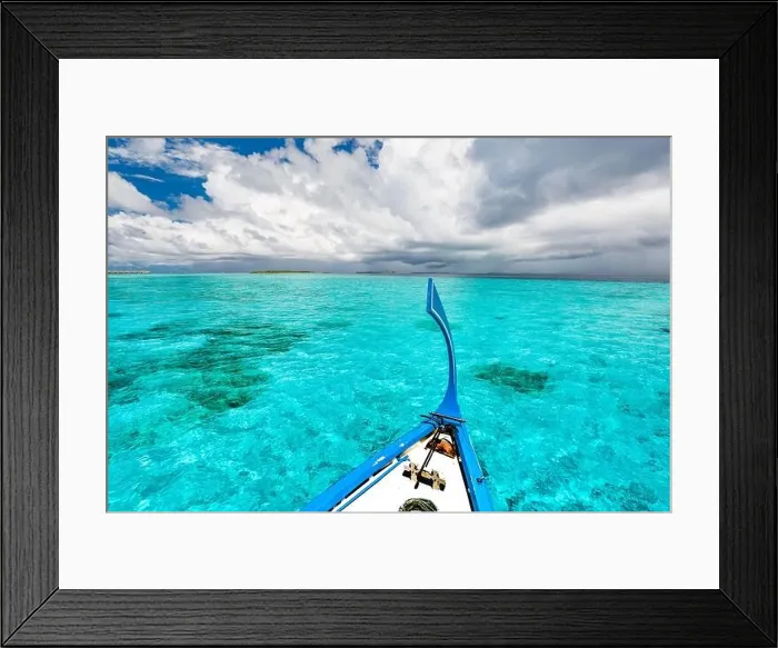 Framed Print : View from the deck of the traditional Maldivian wooden fishing boats on landscape of tropical island with a sandy beach and palm trees Framed Print : View from the deck of the traditional Maldivian wooden fishing boats on landscape of tropical island with a sandy beach and palm trees