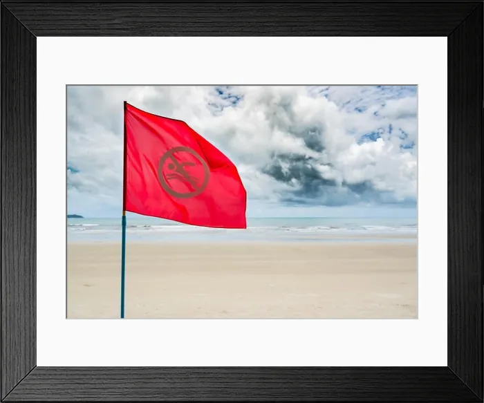 Framed Print : Red no swimming flag warning for tourist not to swim during storm coming in the sea Framed Print : Red no swimming flag warning for tourist not to swim during storm coming in the sea