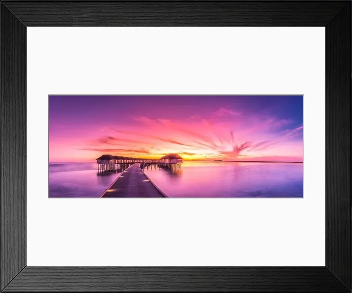 Framed Print : Amazing sunset panorama at Maldives. Luxury resort villas seascape with soft led lights under colorful sky. Beautiful twilight sky and colorful clouds Framed Print : Amazing sunset panorama at Maldives. Luxury resort villas seascape with soft led lights under colorful sky. Beautiful twilight sky and colorful clouds