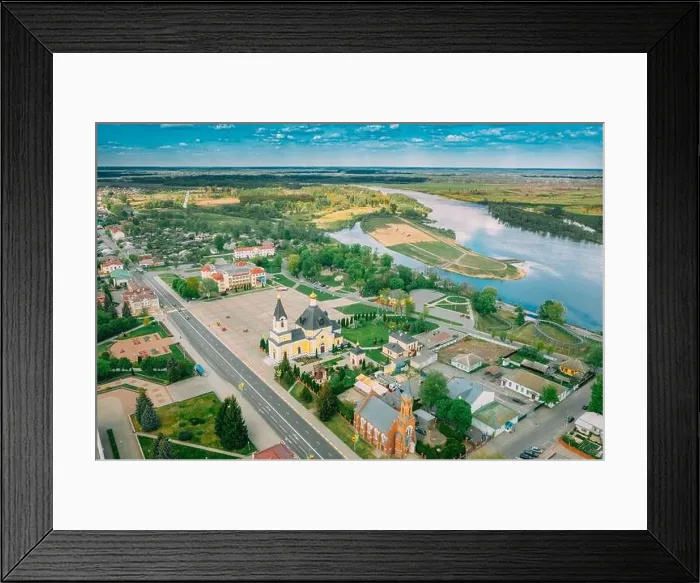 Framed Print : Rechytsa, Belarus. Aerial View Of Residential Houses, River Dnieper And Holy Assumption Cathedral In Sunny Summer Day. Top View. Drone View. Bird's Framed Print : Rechytsa, Belarus. Aerial View Of Residential Houses, River Dnieper And Holy Assumption Cathedral In Sunny Summer Day. Top View. Drone View. Bird's
