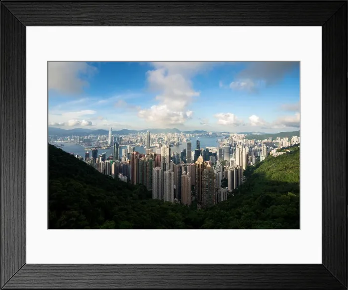 Framed Print : Aerial view of Hong Kong skyline and Victoria Harbor with blue sky in Hong Kong. Asia Framed Print : Aerial view of Hong Kong skyline and Victoria Harbor with blue sky in Hong Kong. Asia