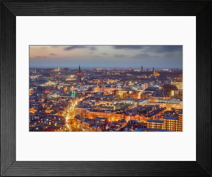 Framed Print : The Hague, Netherlands cityscape with landmark towers in the distance at dusk Framed Print : The Hague, Netherlands cityscape with landmark towers in the distance at dusk