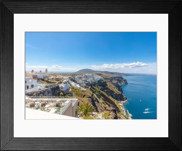 Framed Print : View of the restaurant city of Fira on Sunny summer day. Santorini, Greece. Scenic view traditional cycladic Santorini white houses. Travel landscape Framed Print : View of the restaurant city of Fira on Sunny summer day. Santorini, Greece. Scenic view traditional cycladic Santorini white houses. Travel landscape