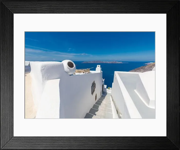 Framed Print : White architecture on Santorini island, Greece. Beautiful landscape, sea view. White wash staircases on Santorini Island, Greece. The view off Caldera Framed Print : White architecture on Santorini island, Greece. Beautiful landscape, sea view. White wash staircases on Santorini Island, Greece. The view off Caldera