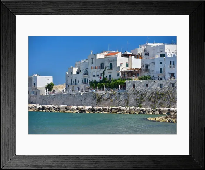 Framed Print : View at the houses from the coast of Vieste on a sunny day, Puglia region, Italy Framed Print : View at the houses from the coast of Vieste on a sunny day, Puglia region, Italy