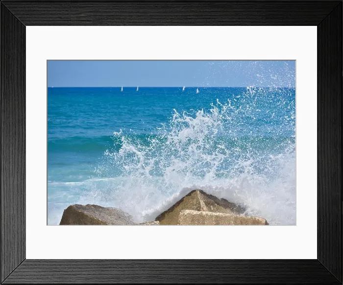 Framed Print : Splash water of sea wave attack to the rock phot with outdoor sunny lighting Framed Print : Splash water of sea wave attack to the rock phot with outdoor sunny lighting