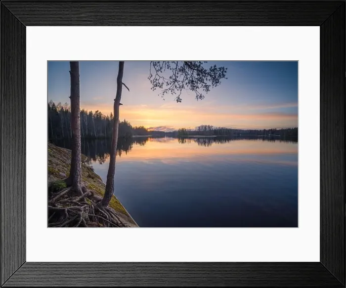 Framed Print : Beautiful sunset in tranquil lake at summer evening in Finland Framed Print : Beautiful sunset in tranquil lake at summer evening in Finland