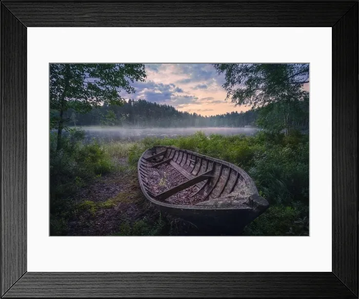 Framed Print : Beautiful sunrise in tranquil lake at summer evening in Finland with wooden boat Framed Print : Beautiful sunrise in tranquil lake at summer evening in Finland with wooden boat