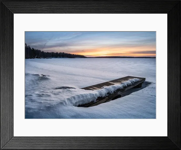 Framed Print : Scenic winter landscape with pier and sunset at evening light in Finland Framed Print : Scenic winter landscape with pier and sunset at evening light in Finland