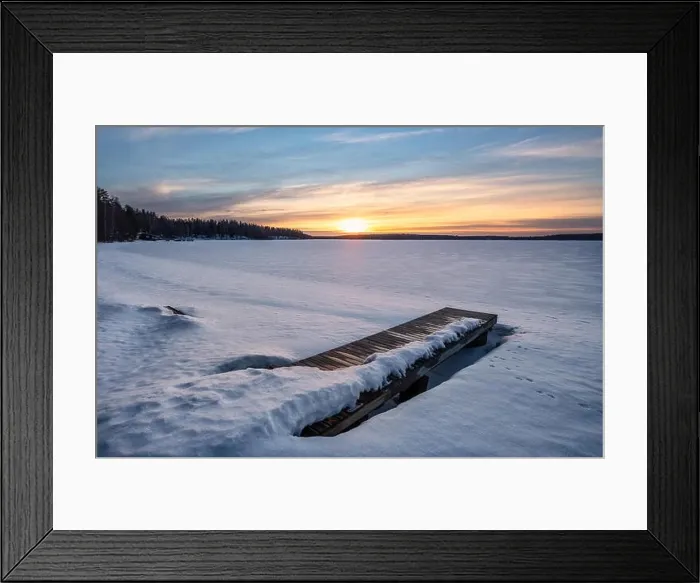 Framed Print : Scenic winter landscape with pier and sunset at evening light in Finland Framed Print : Scenic winter landscape with pier and sunset at evening light in Finland