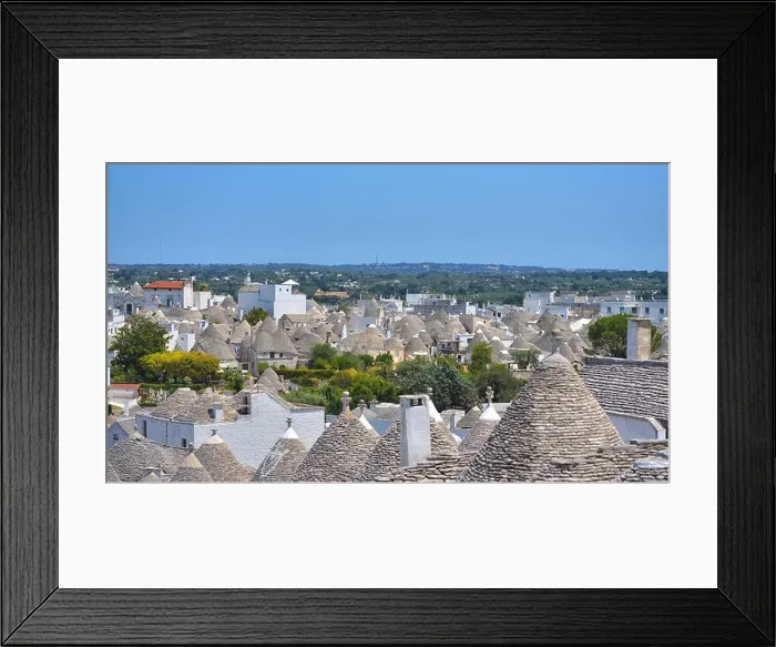 Framed Print : The traditional Trulli houses from the beautiful town Alberobello, Apulia, Italy Framed Print : The traditional Trulli houses from the beautiful town Alberobello, Apulia, Italy