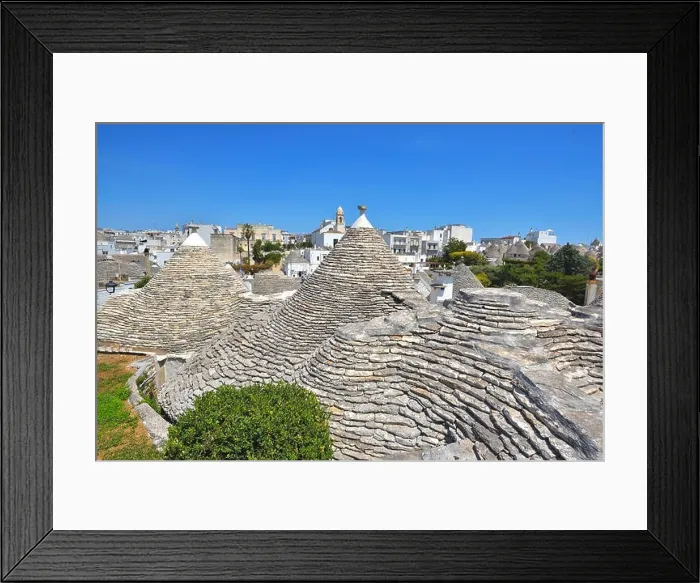 Framed Print : The traditional Trulli houses from the beautiful town Alberobello, Apulia, Italy Framed Print : The traditional Trulli houses from the beautiful town Alberobello, Apulia, Italy