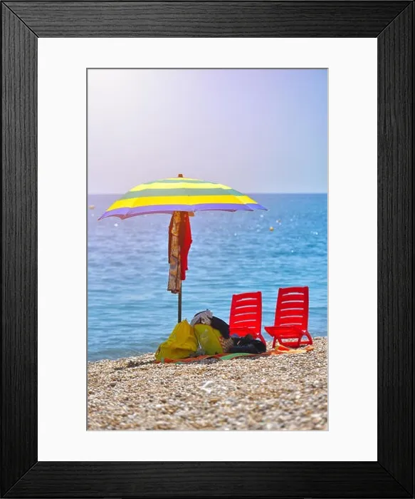 Framed Print : Pair of sun loungers and a beach umbrella on a deserted beach; perfect vacation concept Framed Print : Pair of sun loungers and a beach umbrella on a deserted beach; perfect vacation concept