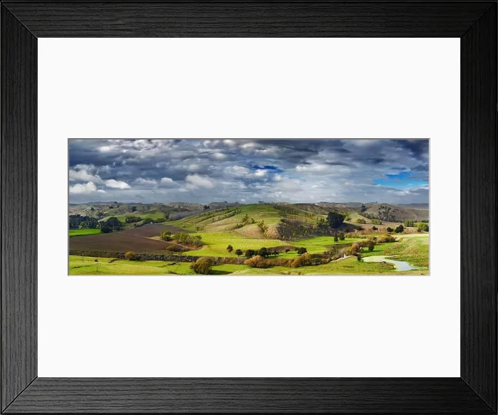 Framed Print : Landscape with farmland and cloudy sky, North Island, New Zealand Framed Print : Landscape with farmland and cloudy sky, North Island, New Zealand