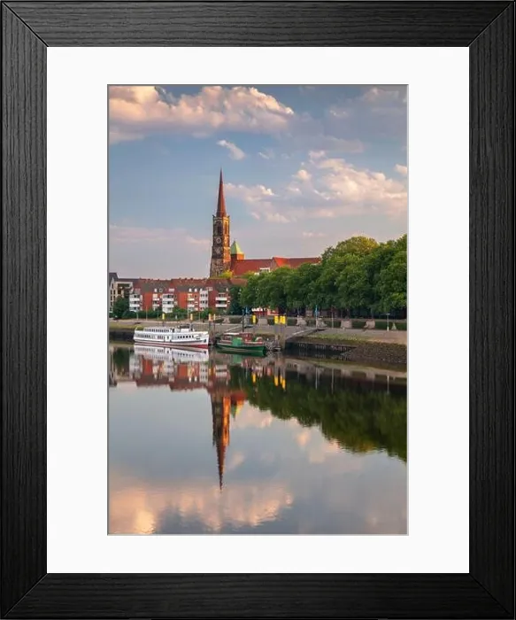 Framed Print : Bremen, Germany. Cityscape image of riverside Bremen, Germany with reflection of the St. Stephani Church in Weser River at summer sunrise Framed Print : Bremen, Germany. Cityscape image of riverside Bremen, Germany with reflection of the St. Stephani Church in Weser River at summer sunrise