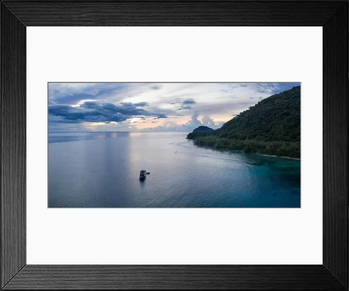 Framed Print : A small dive boat is anchored off the coast of Papua New Guinea. This tropical area is part of the Coral Triangle due to its high marine biodiversity Framed Print : A small dive boat is anchored off the coast of Papua New Guinea. This tropical area is part of the Coral Triangle due to its high marine biodiversity