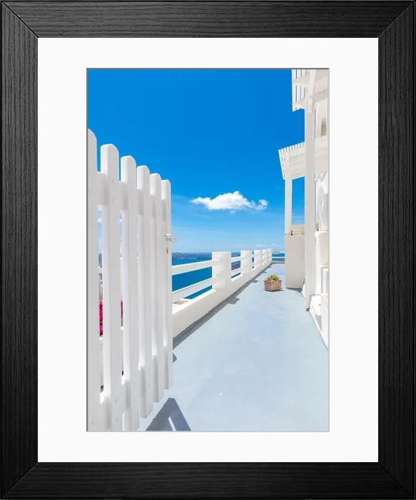 Framed Print : Open white door overlooking the sea and Caldera, famous door to Santorini, Greece. Luxury travel vertical banner, amazing sea view, blue sky landscape
