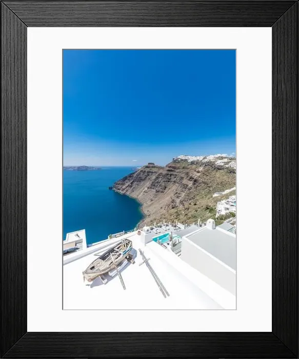 Framed Print : Old wooden boat on the white rooftops of caldera in Santorini, Greece. Amazing summer landscape, travel adventure, sea view over white architecture Framed Print : Old wooden boat on the white rooftops of caldera in Santorini, Greece. Amazing summer landscape, travel adventure, sea view over white architecture