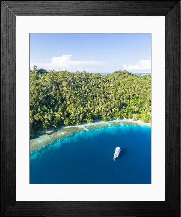 Framed Print : A small dive boat is anchored off the coast of Papua New Guinea. This tropical area is part of the Coral Triangle due to its high marine biodiversity Framed Print : A small dive boat is anchored off the coast of Papua New Guinea. This tropical area is part of the Coral Triangle due to its high marine biodiversity