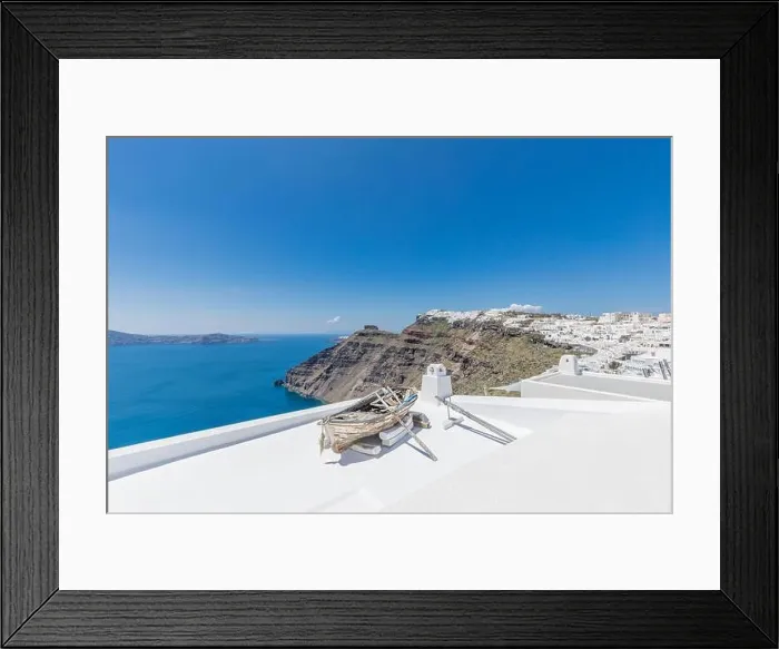 Framed Print : Old wooden boat on the white rooftops of caldera in Santorini, Greece. Amazing summer landscape, travel adventure, sea view over white architecture Framed Print : Old wooden boat on the white rooftops of caldera in Santorini, Greece. Amazing summer landscape, travel adventure, sea view over white architecture