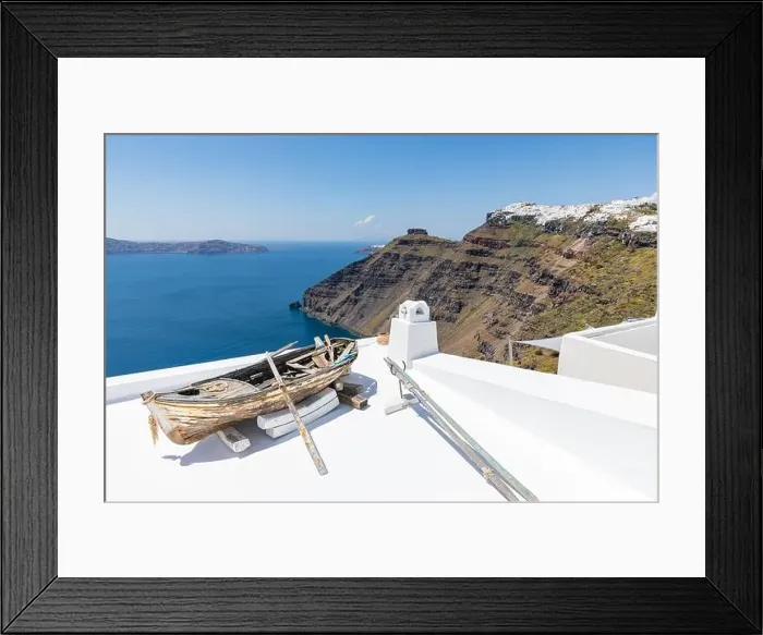 Framed Print : Old wooden boat on the white rooftops of caldera in Santorini, Greece. Amazing summer landscape, travel adventure, sea view over white architecture Framed Print : Old wooden boat on the white rooftops of caldera in Santorini, Greece. Amazing summer landscape, travel adventure, sea view over white architecture
