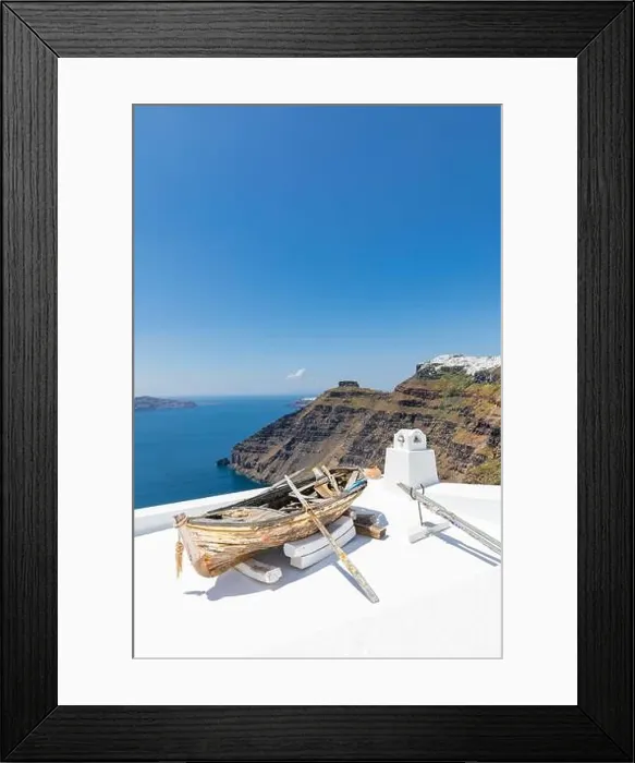 Framed Print : Old wooden boat on the white rooftops of caldera in Santorini, Greece. Amazing summer landscape, travel adventure, sea view over white architecture Framed Print : Old wooden boat on the white rooftops of caldera in Santorini, Greece. Amazing summer landscape, travel adventure, sea view over white architecture