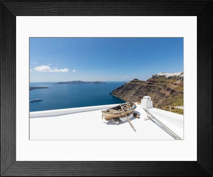 Framed Print : Old wooden boat on the white rooftops of caldera in Santorini, Greece. Amazing summer landscape, travel adventure, sea view over white architecture Framed Print : Old wooden boat on the white rooftops of caldera in Santorini, Greece. Amazing summer landscape, travel adventure, sea view over white architecture