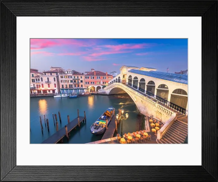 Framed Print : Venice, Italy at the Rialto Bridge over the Grand Canal at twilight. (Sign reading in Italian No Mafia Venezia e Sacra translates in English to No Framed Print : Venice, Italy at the Rialto Bridge over the Grand Canal at twilight. (Sign reading in Italian No Mafia Venezia e Sacra translates in English to No