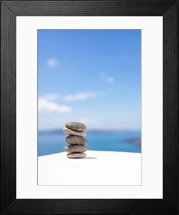 Framed Print : Stones balance, pebbles stack on seascape view. Relaxing concept, white and blue colors Framed Print : Stones balance, pebbles stack on seascape view. Relaxing concept, white and blue colors