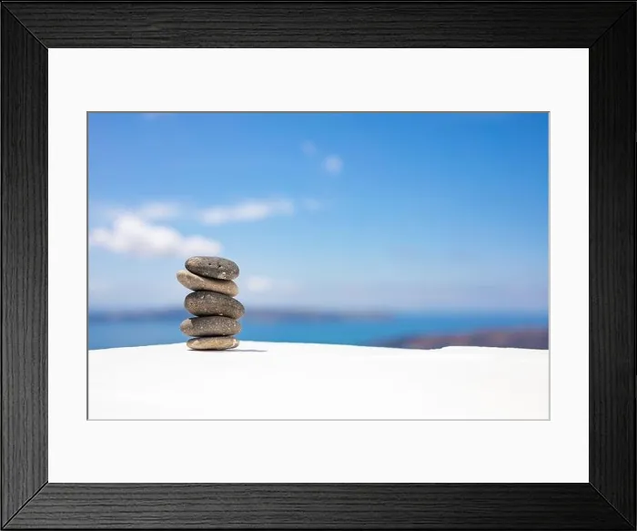 Framed Print : Stones balance, pebbles stack on seascape view. Relaxing concept, white and blue colors Framed Print : Stones balance, pebbles stack on seascape view. Relaxing concept, white and blue colors