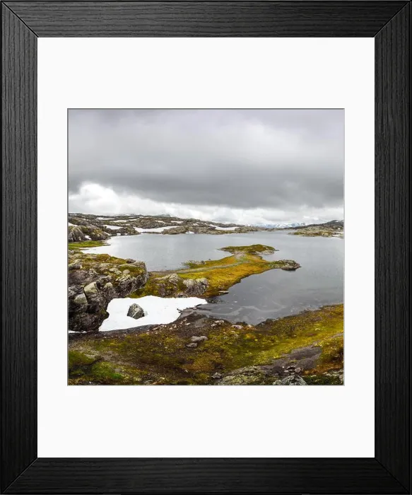 Framed Print : Typical norwegian landscape with snowy mountains and clear lake near the Trolltunga rock - most spectacular and famous scenic cliff in Norway Framed Print : Typical norwegian landscape with snowy mountains and clear lake near the Trolltunga rock - most spectacular and famous scenic cliff in Norway