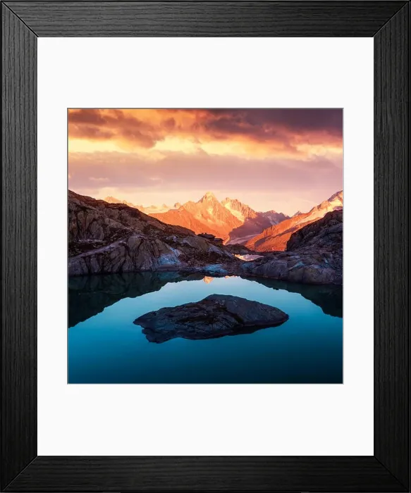 Framed Print : Alpine mountain landscape with lake and peaks covered by snow on sunset time Framed Print : Alpine mountain landscape with lake and peaks covered by snow on sunset time