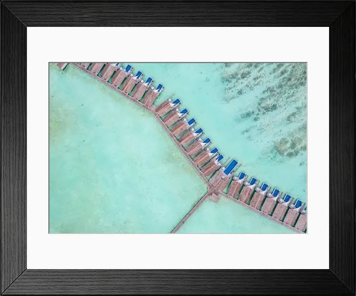 Framed Print : Amazing bird eyes view in Maldives, landscape seascape aerial view over a Maldives. Landscape, luxury tropical resort or hotel with water villas beach Framed Print : Amazing bird eyes view in Maldives, landscape seascape aerial view over a Maldives. Landscape, luxury tropical resort or hotel with water villas beach