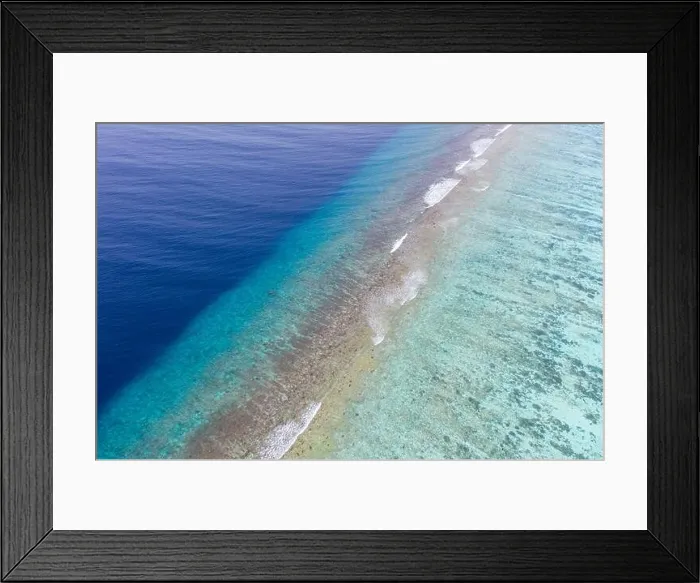 Framed Print : Top view aerial photo from flying drone. Beautiful beach. Aerial view of calm waves, breaking at coral reef. Exotic ocean beach, tropical landscape Framed Print : Top view aerial photo from flying drone. Beautiful beach. Aerial view of calm waves, breaking at coral reef. Exotic ocean beach, tropical landscape
