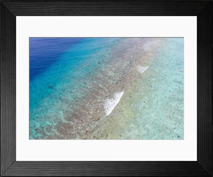 Framed Print : Top view aerial photo from flying drone. Beautiful beach. Aerial view of calm waves, breaking at coral reef. Exotic ocean beach, tropical landscape Framed Print : Top view aerial photo from flying drone. Beautiful beach. Aerial view of calm waves, breaking at coral reef. Exotic ocean beach, tropical landscape