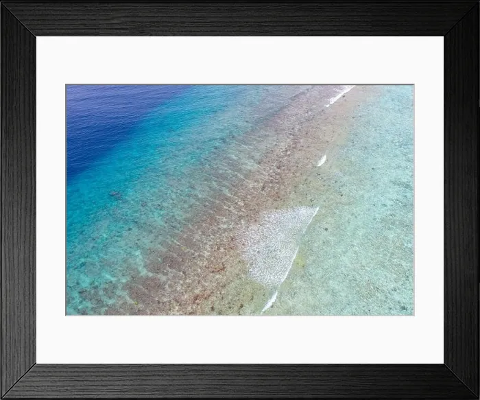 Framed Print : Top view aerial photo from flying drone. Beautiful beach. Aerial view of calm waves, breaking at coral reef. Exotic ocean beach, tropical landscape Framed Print : Top view aerial photo from flying drone. Beautiful beach. Aerial view of calm waves, breaking at coral reef. Exotic ocean beach, tropical landscape