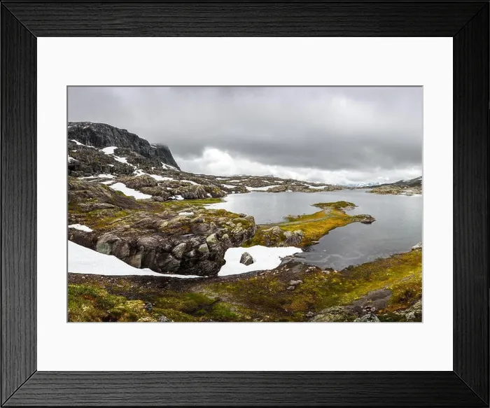 Framed Print : Typical norwegian landscape with snowy mountains and clear lake near the Trolltunga rock - most spectacular and famous scenic cliff in Norway Framed Print : Typical norwegian landscape with snowy mountains and clear lake near the Trolltunga rock - most spectacular and famous scenic cliff in Norway