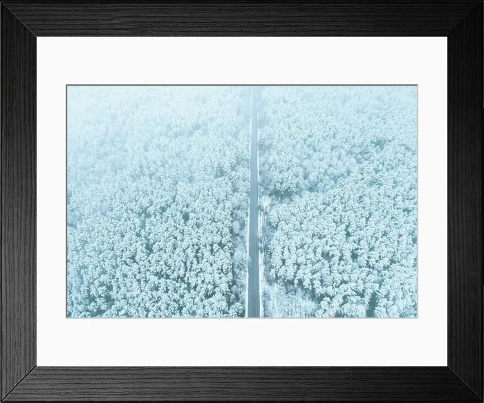 Framed Print : Aerial view of highway road through snow forest landscape in winter. Top view of highway motorway freeway from high attitude. Trip and travel concept Framed Print : Aerial view of highway road through snow forest landscape in winter. Top view of highway motorway freeway from high attitude. Trip and travel concept